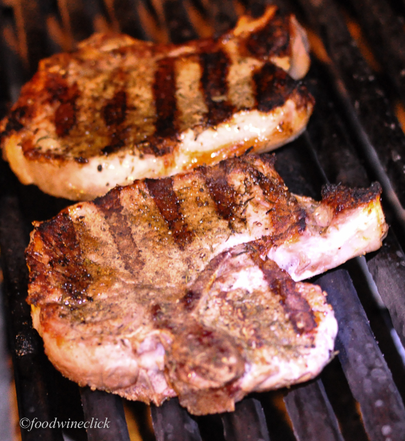 Pork chops on the grill (lit by headlamp).