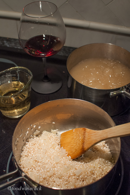 Feed the risotto liquid a little at a time, then take a sip of wine.