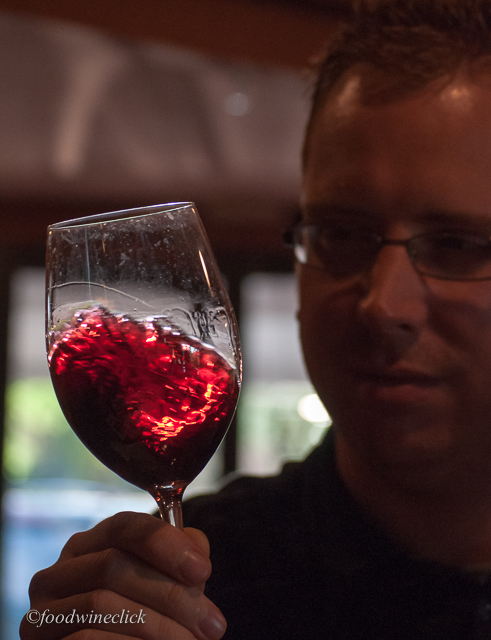 Nicholas swirling a glass of Cabernet Sauvignon