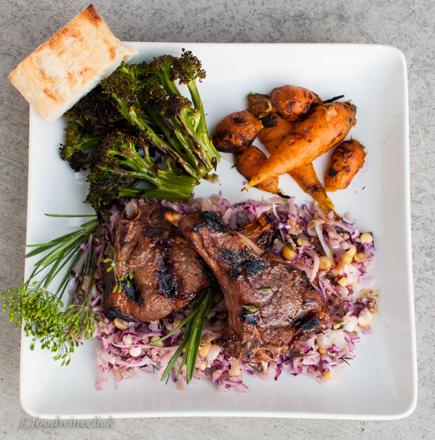 Grilled Lamb Chops on a bed of slaw with roasted brocolli and carrots