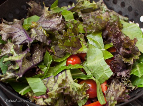 salad ingredients in a grill basket