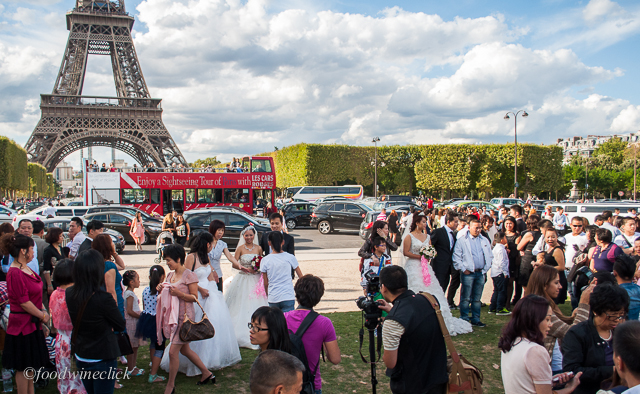 brides at the eiffel tower