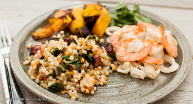 Cous-cous with roasted radishes and radish greens surrounded by shrimp, calamari, and roasted mango