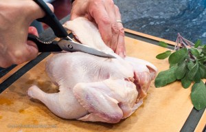 It's really easy, just cut up either side of the spine.