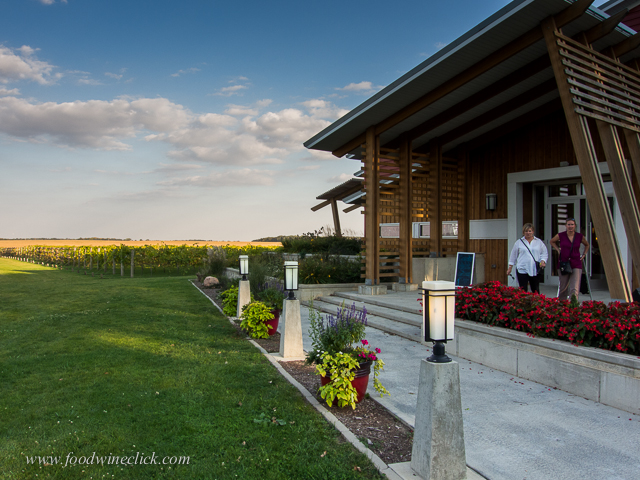 A polarizing filter will darken the blue sky and make the clouds pop.