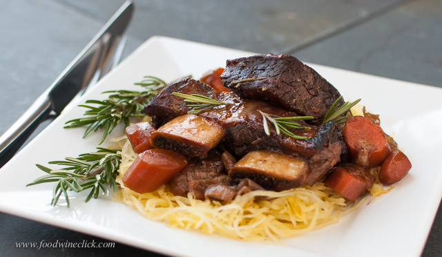 Short ribs braised for hours in a bath of onions, carrots and dark beer