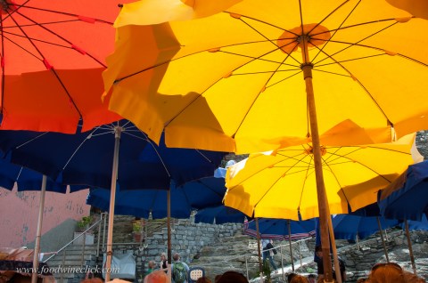 Bright sunny day in the Cinque Terre. We're eating outdoors, but the light is filtered through the beautiful unbrellas.