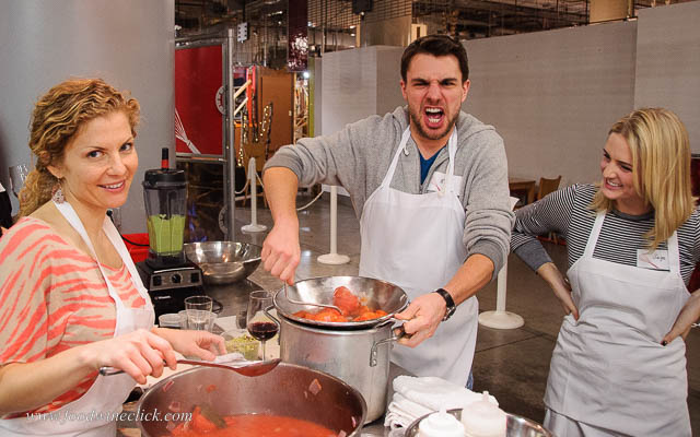 Hand cranking tomato sauce at Kitchen in the Market