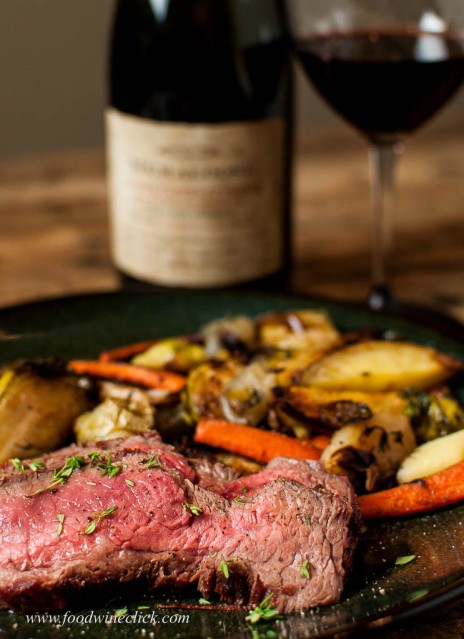 Flank steak, roasted root vegetables and a glass of red wine