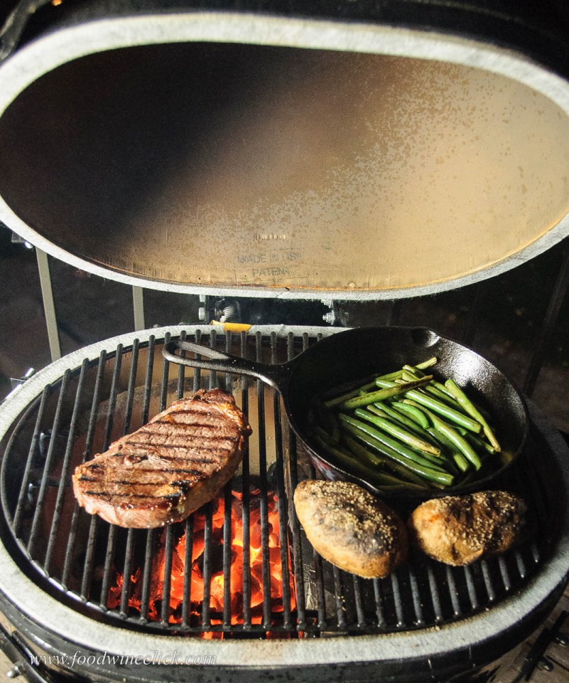 Primo grill with ribeye steak, potatoes and green beans