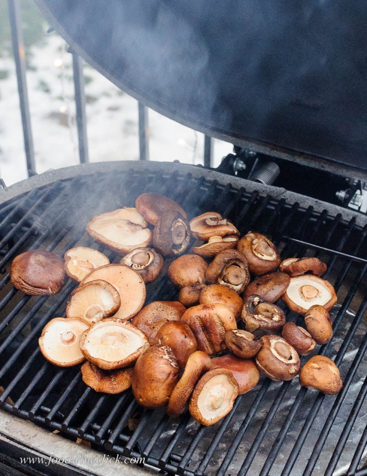 mushrooms smoking on a Primo grill