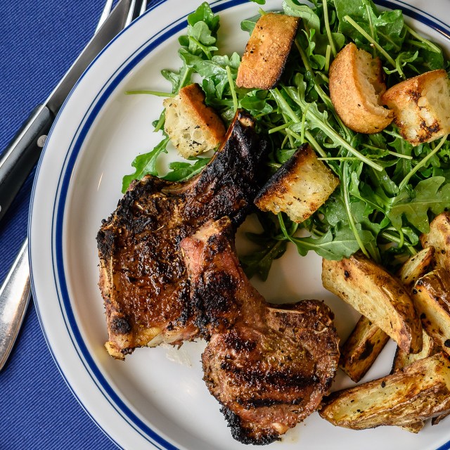 Grilled lamb chops, potatoes and arugula salad