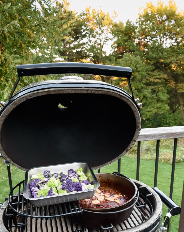 Primo ceramic grill with brisket and vegetables