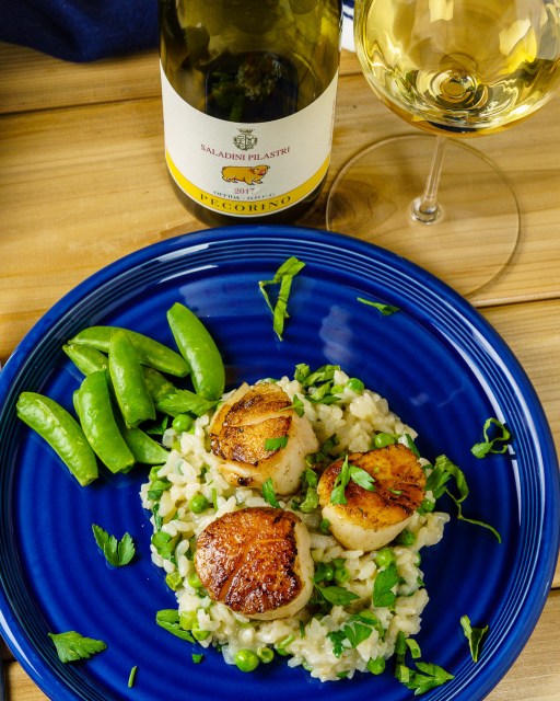 Seared scallops and risotto served with Pecorino white wine.